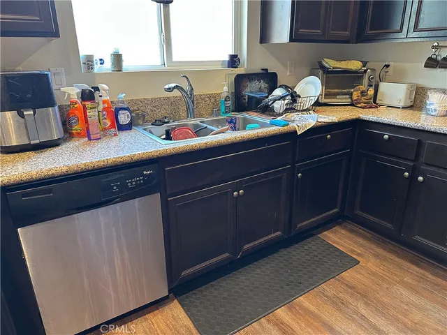 a kitchen with a sink and cabinets