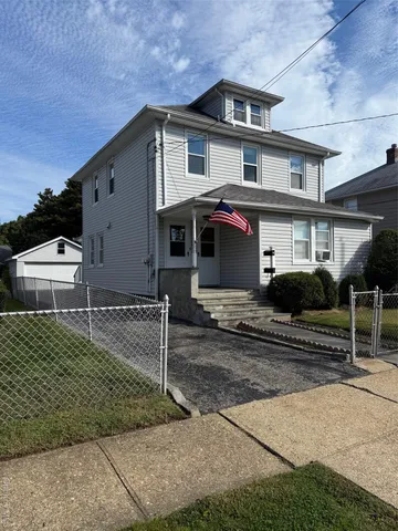 a front view of a house with a garage