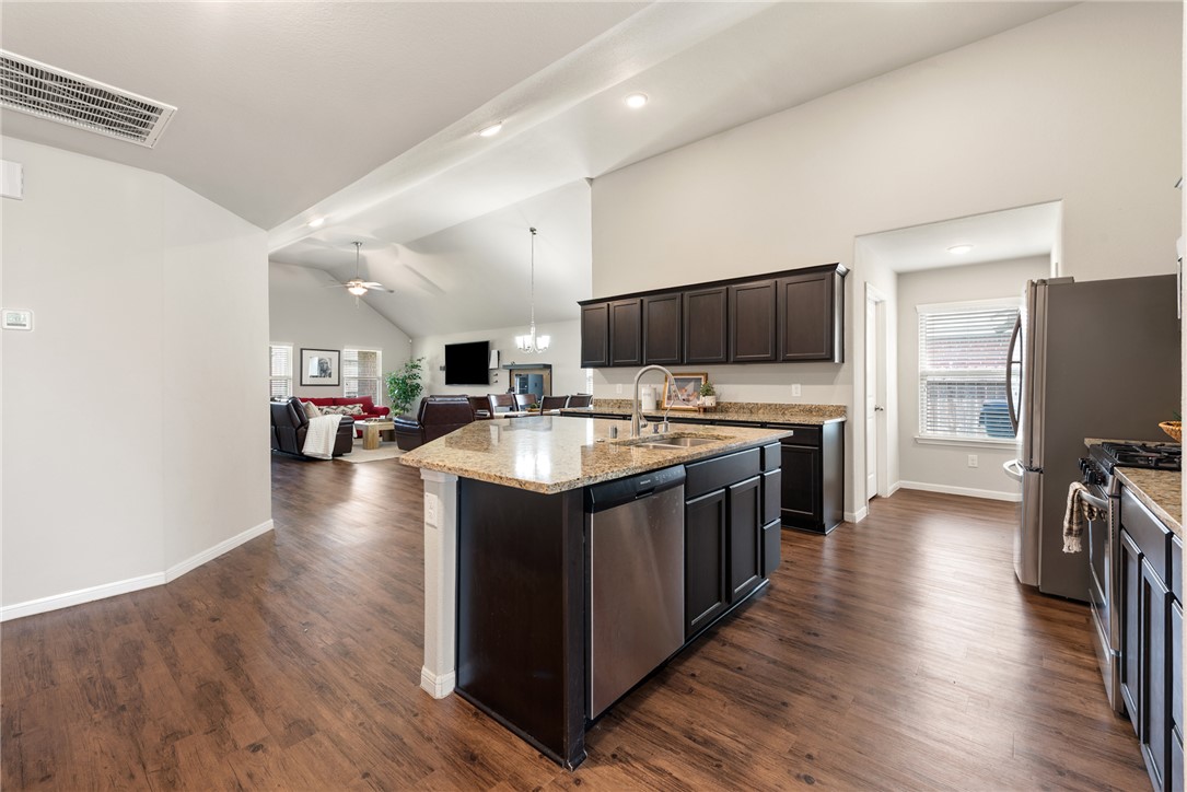 2018 Eagle View Drive Navasota, TX 77868 - Photo 2 of 28 a kitchen with stainless steel appliances granite countertop a sink stove and wooden floor