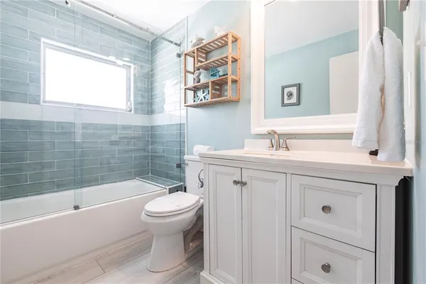 a bathroom with a sink a toilet and a bathtub