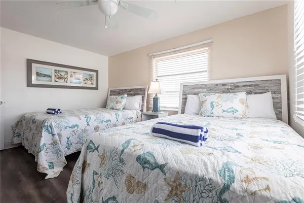 a bedroom with bed and window