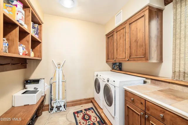 a bedroom with bed and a flat screen tv