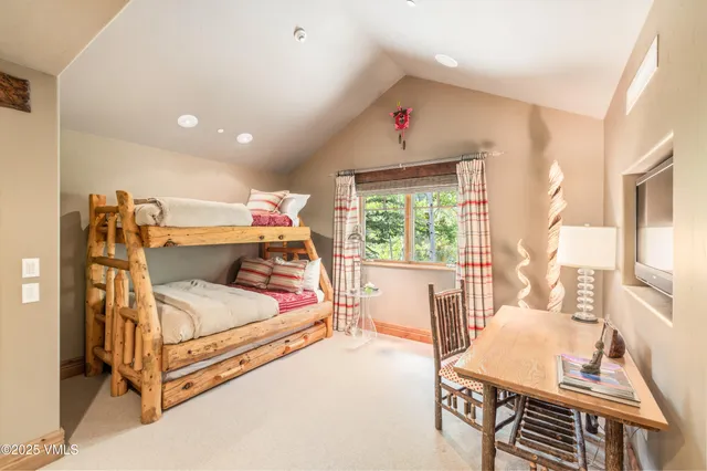 a bathroom with a granite countertop sink mirror vanity and toilet