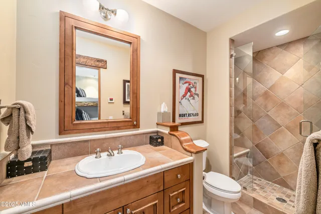 a living room with furniture fireplace and a large window