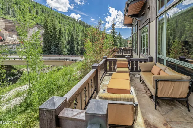 a view of a garden with mountains in the background
