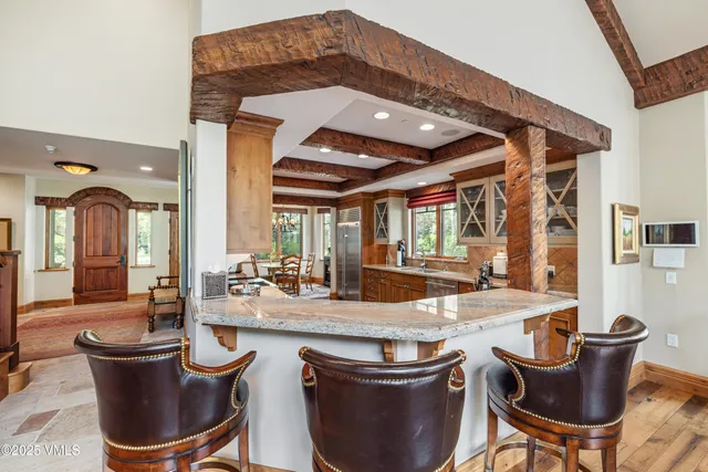 a dining room with a table and chairs