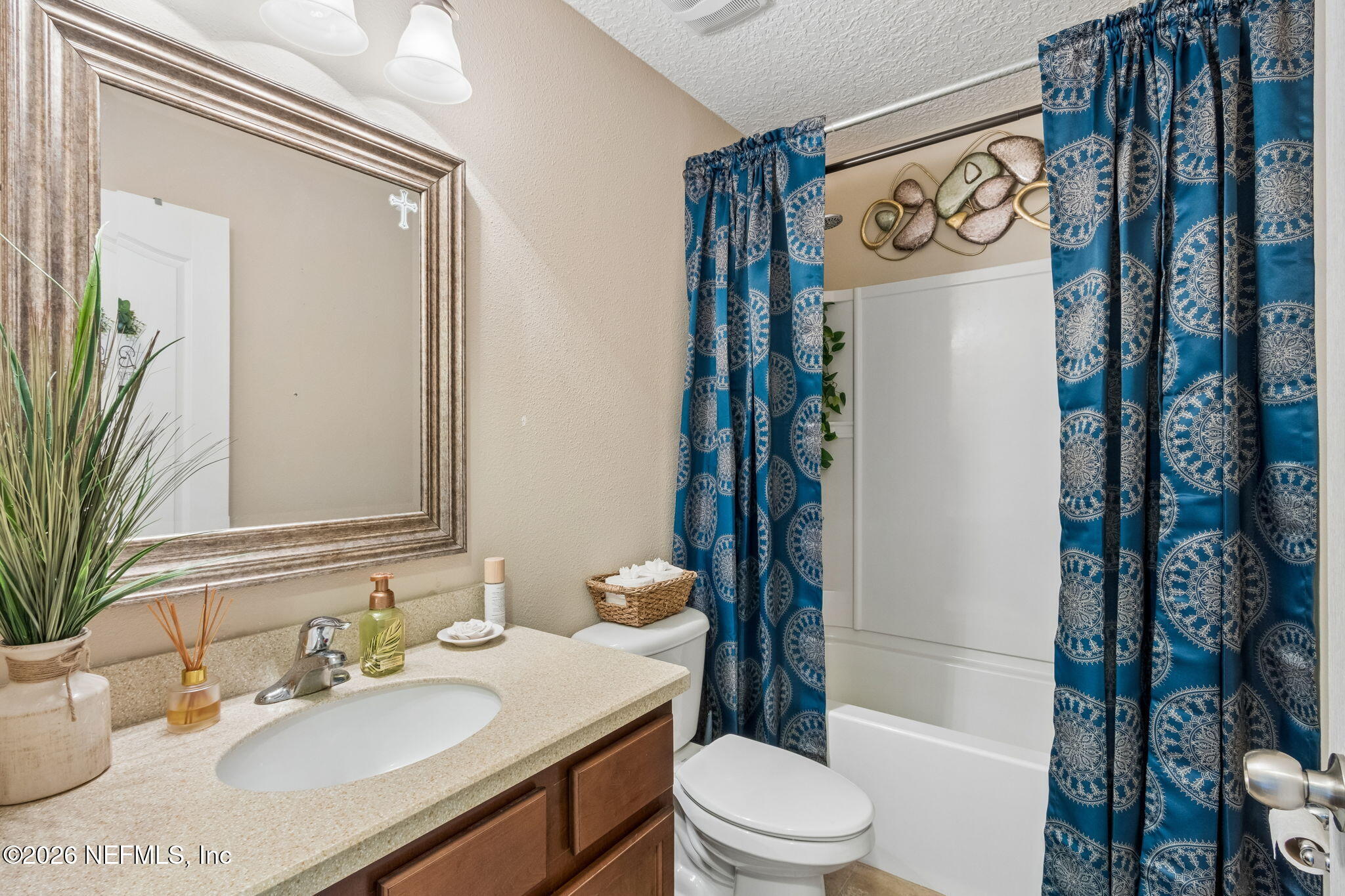 96034 Bass Lane Yulee, FL 32097 - Photo 37 of 50 a bathroom with a sink a toilet and shower