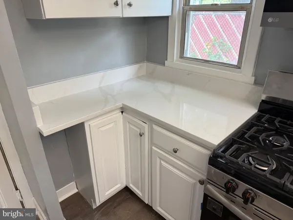 a view of an empty room with cabinet