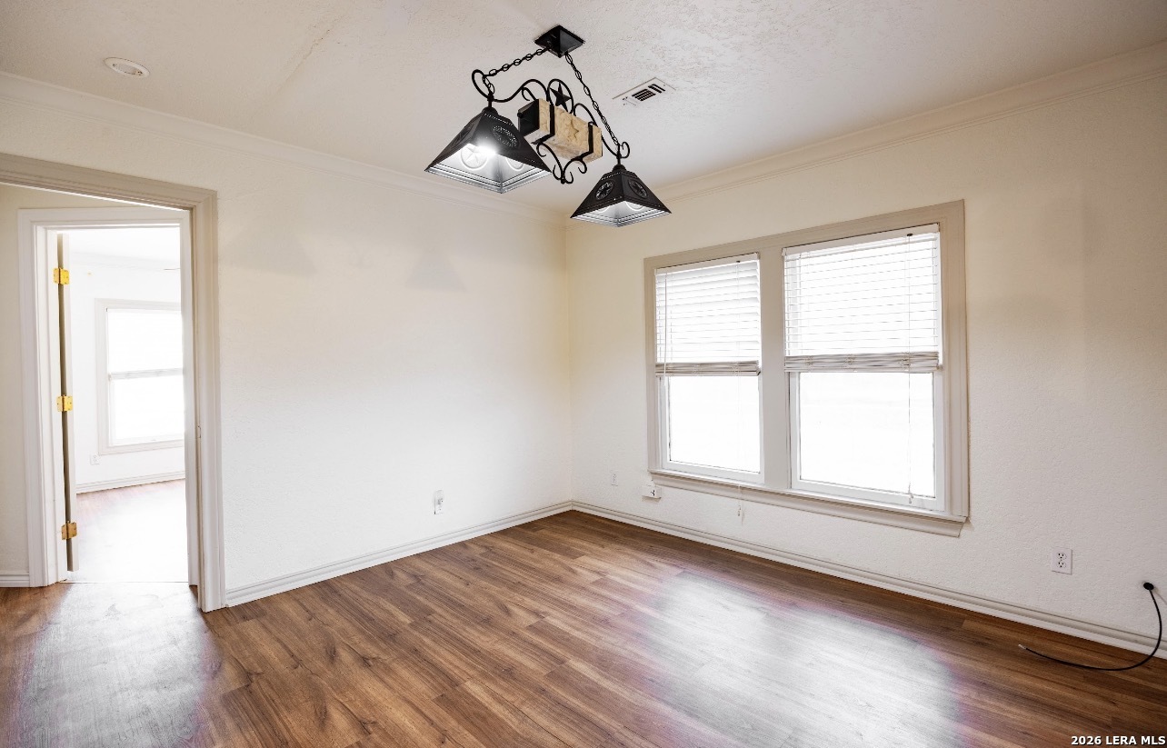149 South Carroll Street Poth, TX 78147 - Photo 7 of 28 a view of empty room with wooden floor and fan