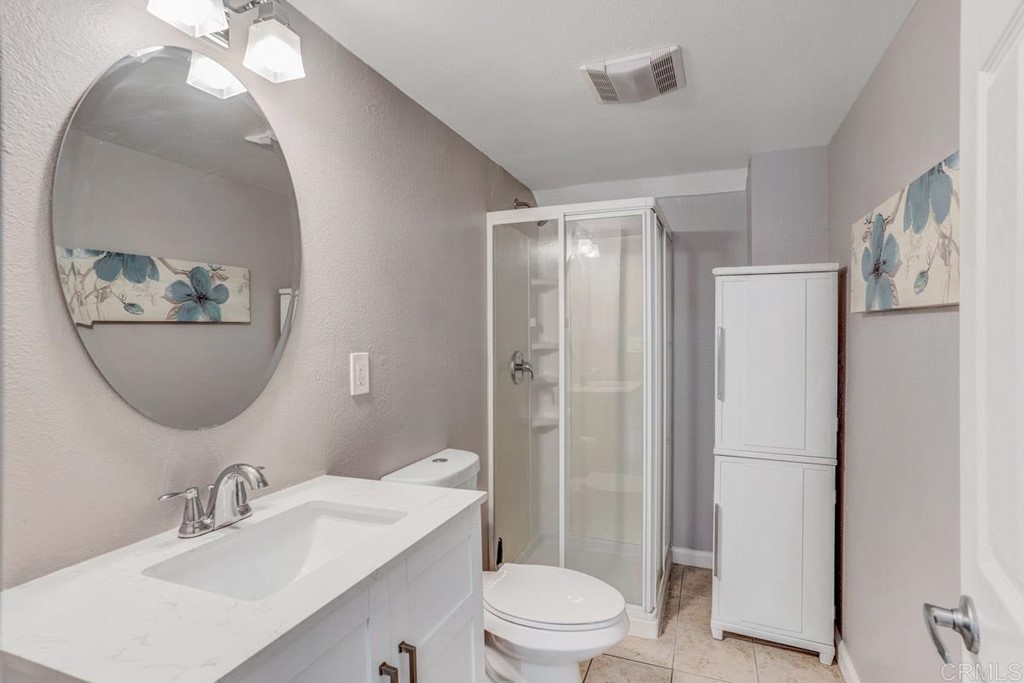441 Bougher Road San Marcos, CA 92069 - Photo 20 of 39 a bathroom with a sink toilet and shower