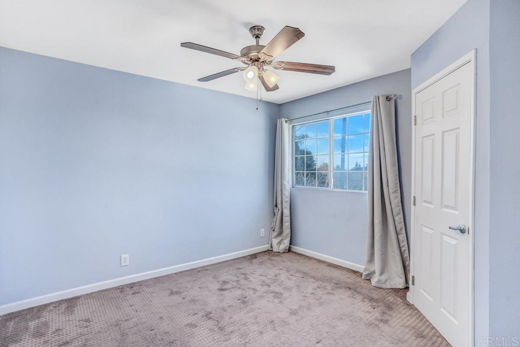 441 Bougher Road San Marcos, CA 92069 - Photo 32 of 39 a view of a livingroom with a ceiling fan and window