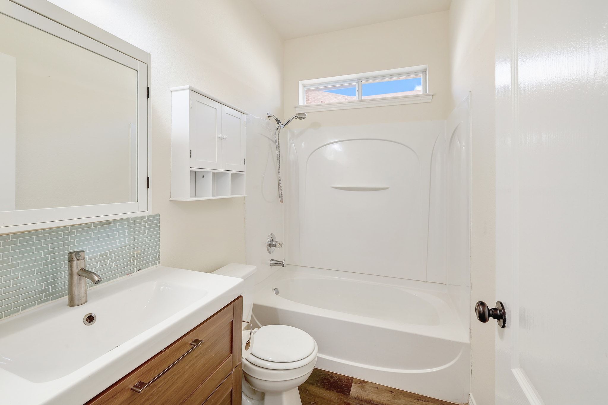 2307 Hayfield Square Pflugerville, TX 78660 - Photo 26 of 40 a bathroom with a sink a toilet and shower
