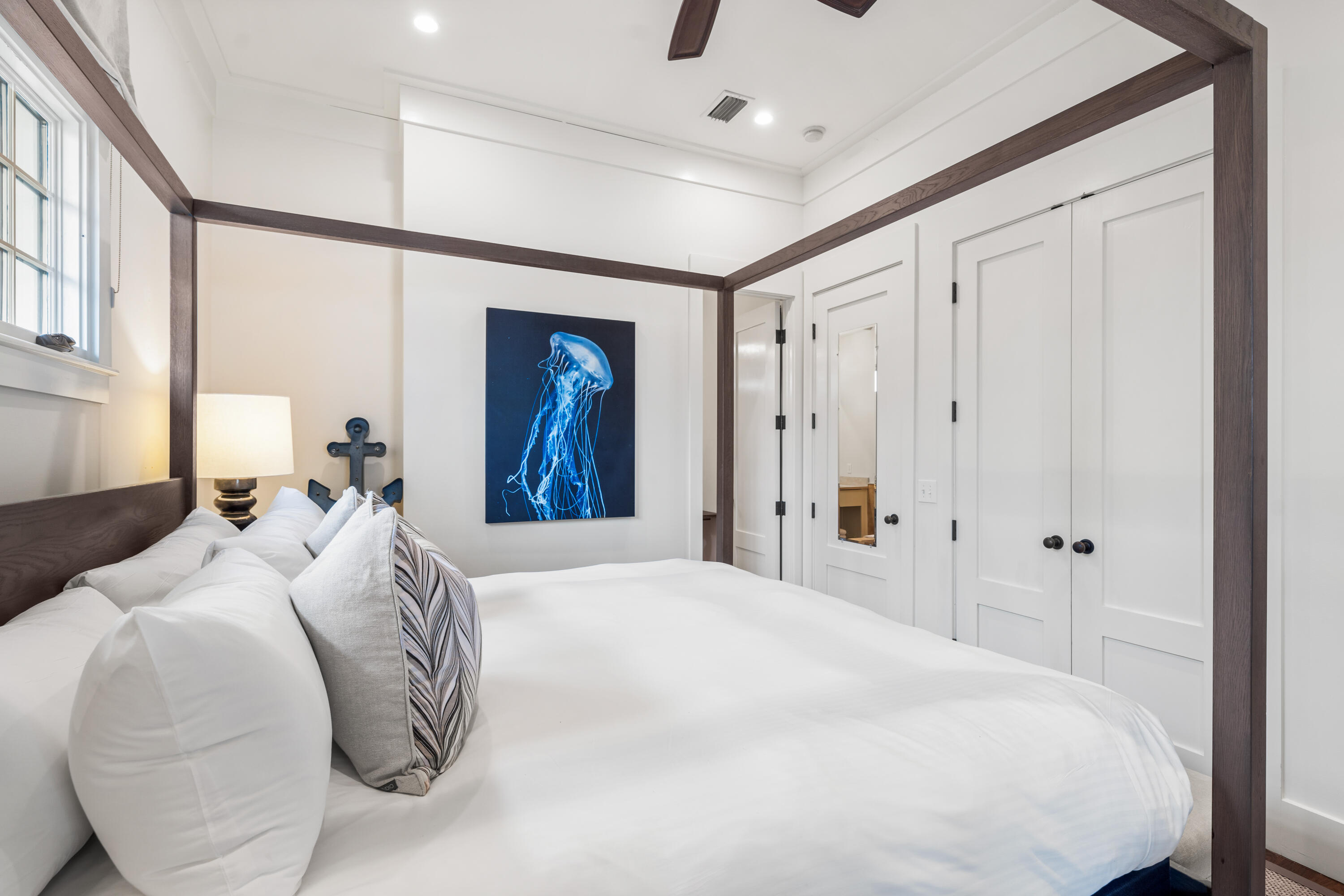 36 Town Hall Road Rosemary Beach, FL 32461 - Photo 19 of 62 a bedroom with a large bed and a chandelier