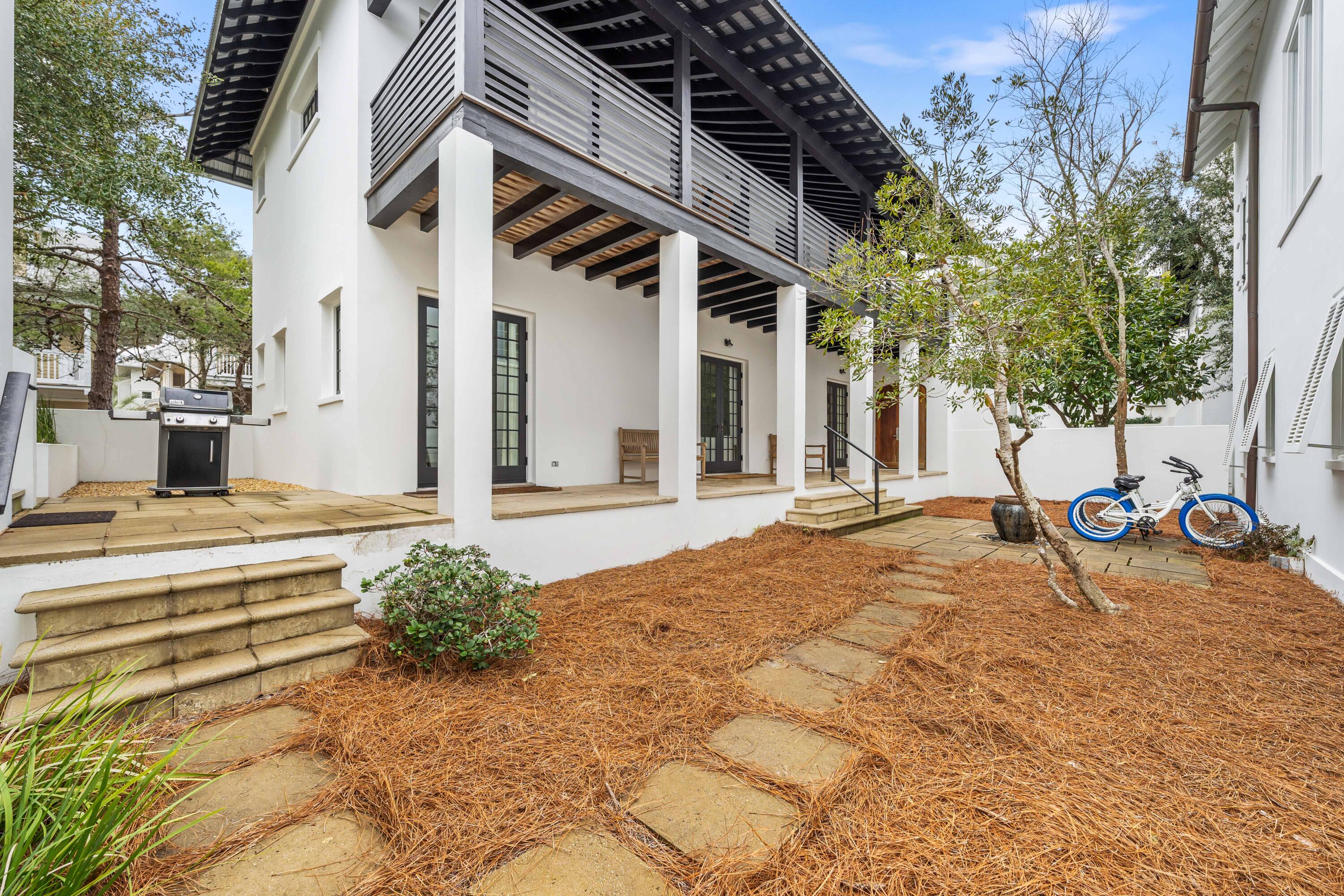 36 Town Hall Road Rosemary Beach, FL 32461 - Photo 3 of 62 a view of a house with backyard and sitting area