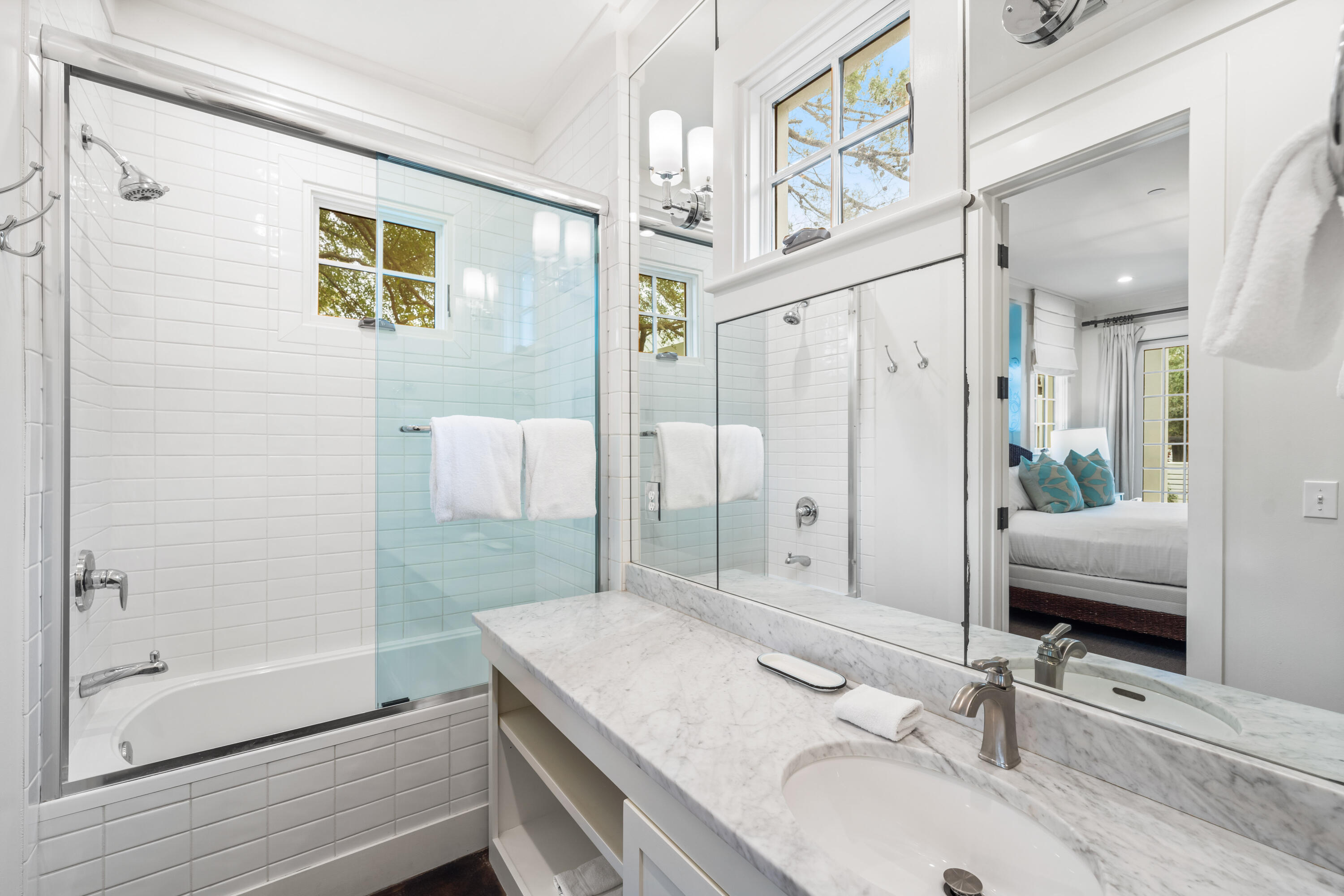 36 Town Hall Road Rosemary Beach, FL 32461 - Photo 39 of 62 a spacious bathroom with a granite countertop sink a mirror a bathtub and shower