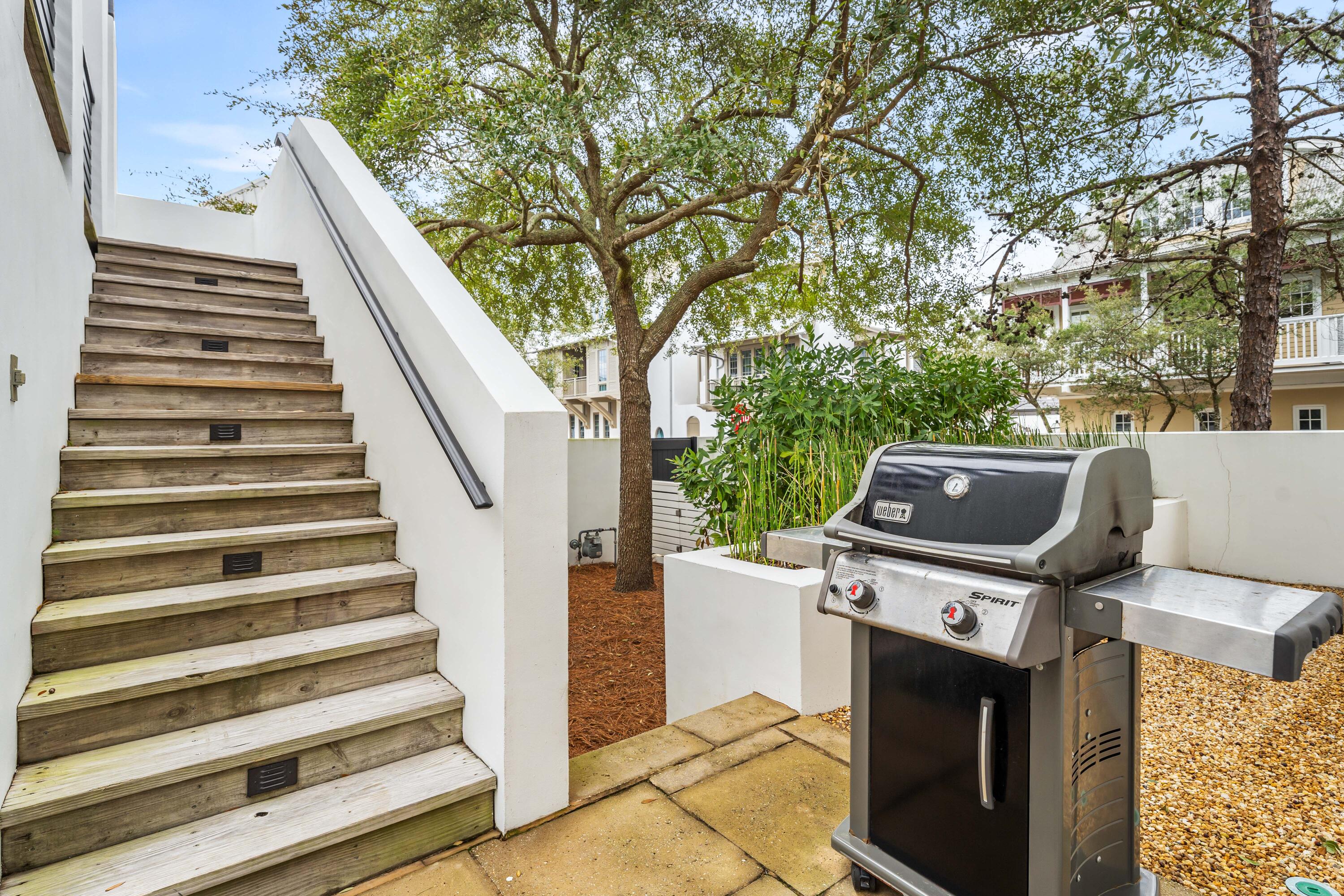 36 Town Hall Road Rosemary Beach, FL 32461 - Photo 46 of 62 a view of a house with a stove and wooden fence