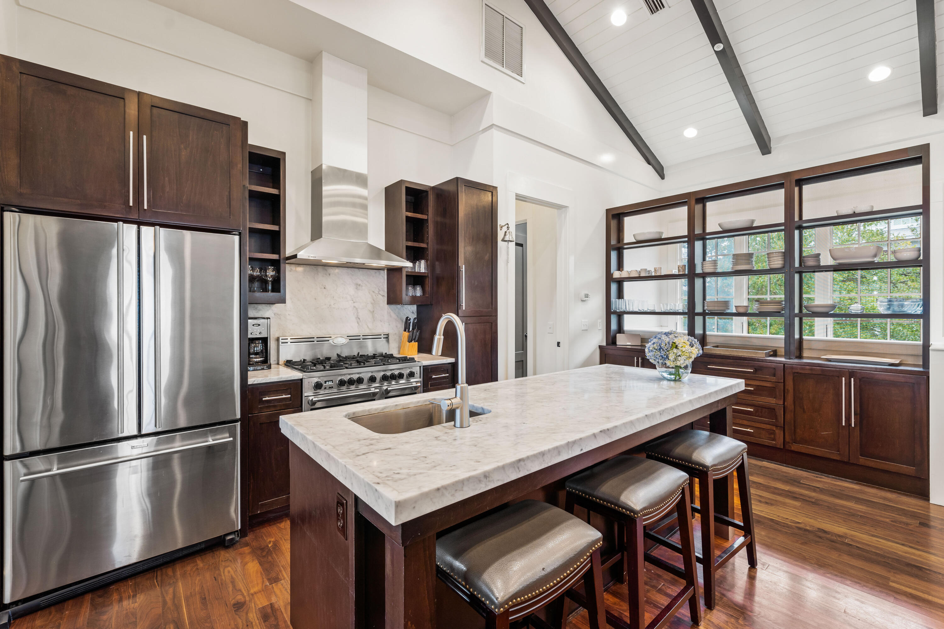 36 Town Hall Road Rosemary Beach, FL 32461 - Photo 7 of 62 a kitchen with stainless steel appliances a dining table chairs refrigerator and sink