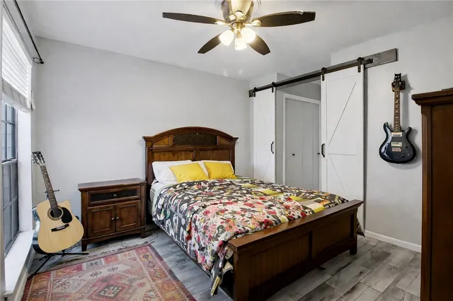 a bedroom with a bed and cabinets