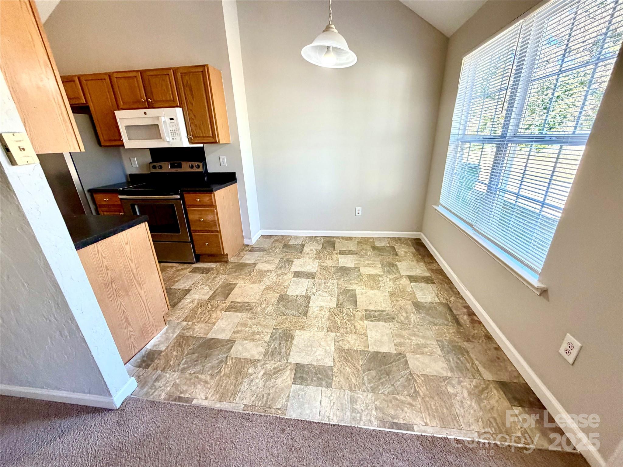 910 Rucker Cliff Drive Charlotte, NC 28214 - Photo 11 of 23 a bedroom with a bed and a mirror