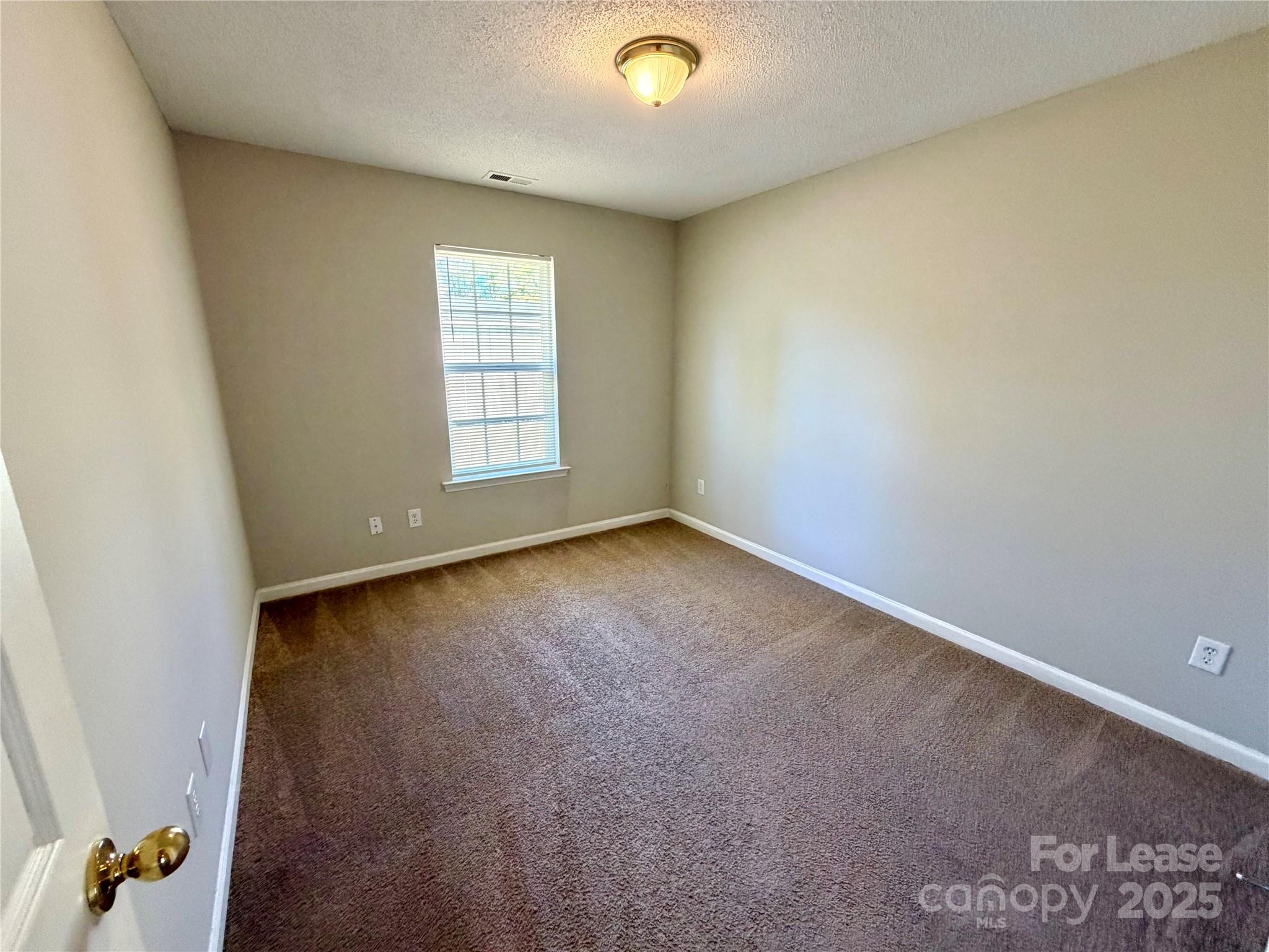 910 Rucker Cliff Drive Charlotte, NC 28214 - Photo 18 of 23 an empty room with a window