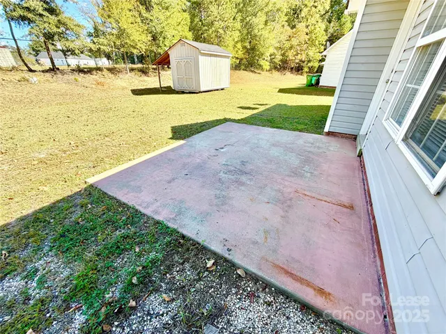 a view of a backyard with ocean view