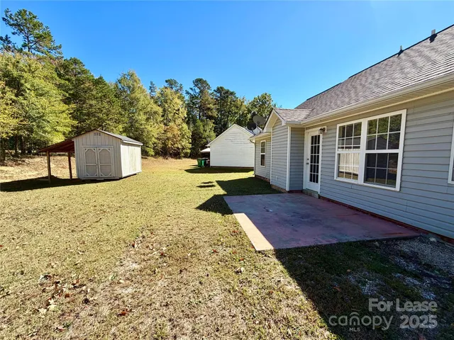 a view of a backyard of the house