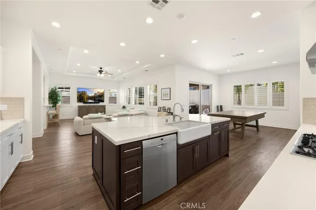 a view of a livingroom with furniture window and wooden floor