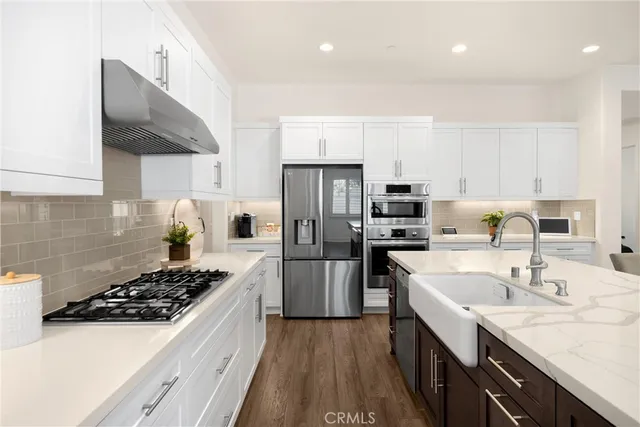 a view of a livingroom with furniture window and wooden floor