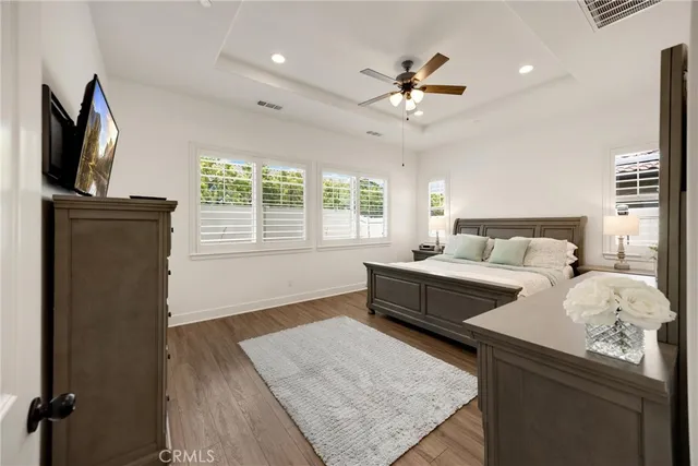 a en suite bathroom with a granite countertop sink mirror and shower
