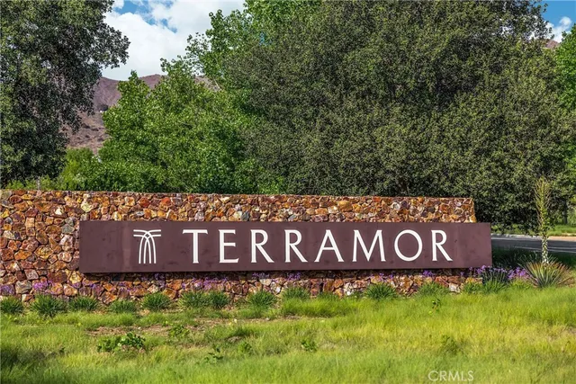a view of a house with swimming pool outdoor seating