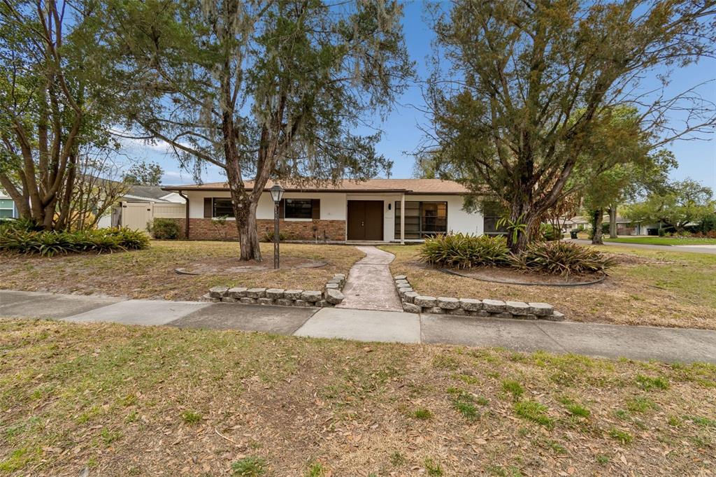2708 Lion Heart Road Winter Park, FL 32792 - Photo 1 of 47 a front view of a house with a yard