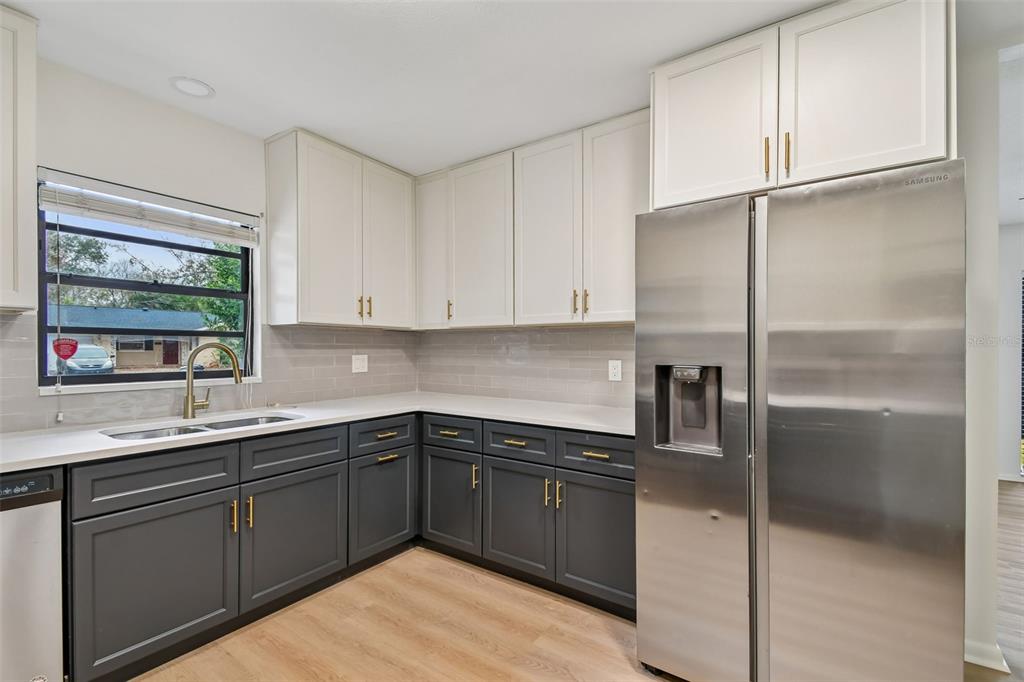 2708 Lion Heart Road Winter Park, FL 32792 - Photo 12 of 47 a kitchen with a sink and cabinets