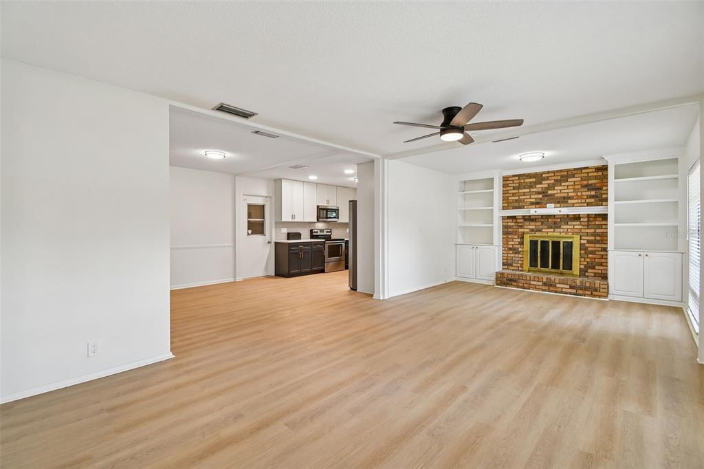 2708 Lion Heart Road Winter Park, FL 32792 - Photo 13 of 47 a view of an empty room with a window and kitchen view