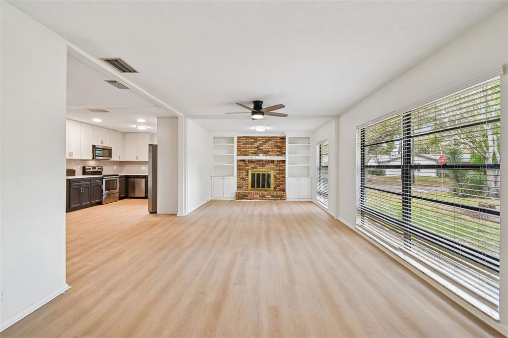 2708 Lion Heart Road Winter Park, FL 32792 - Photo 14 of 47 a view of an empty room with a window and wooden floor