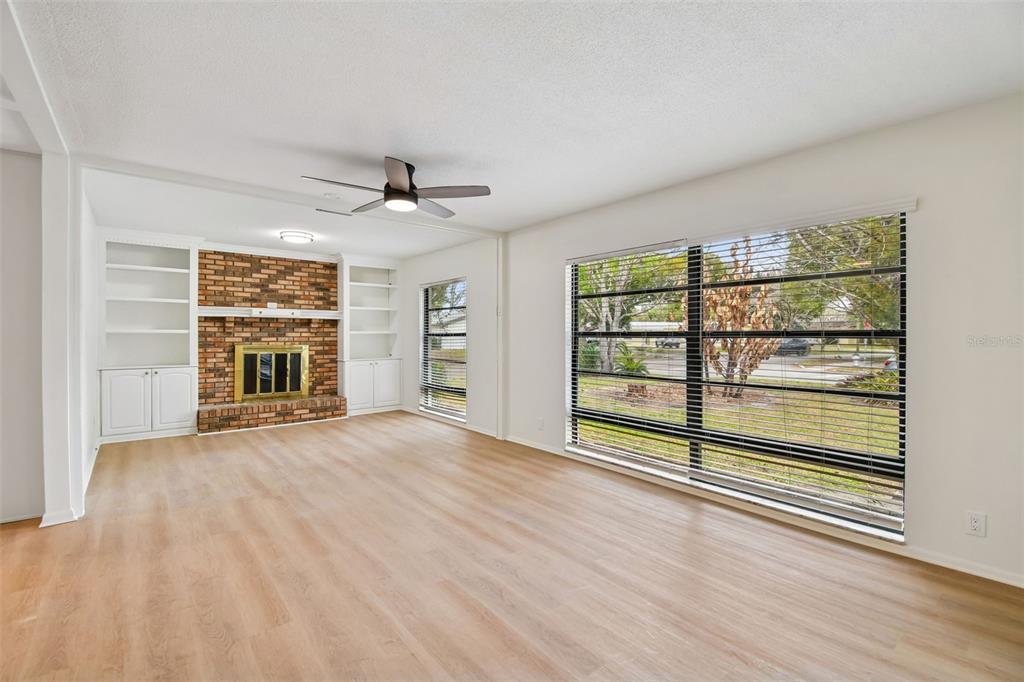 2708 Lion Heart Road Winter Park, FL 32792 - Photo 15 of 47 a view of an empty room with a window and wooden floor