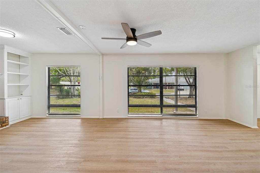 2708 Lion Heart Road Winter Park, FL 32792 - Photo 16 of 47 an empty room with wooden floor and windows