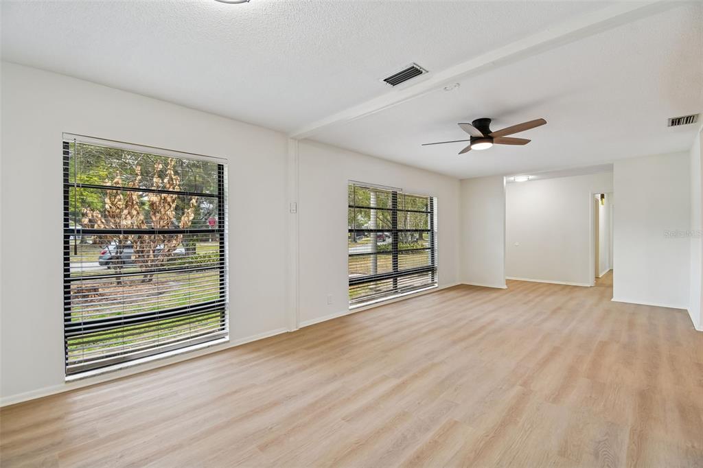 2708 Lion Heart Road Winter Park, FL 32792 - Photo 17 of 47 a view of an empty room with a window and wooden floor