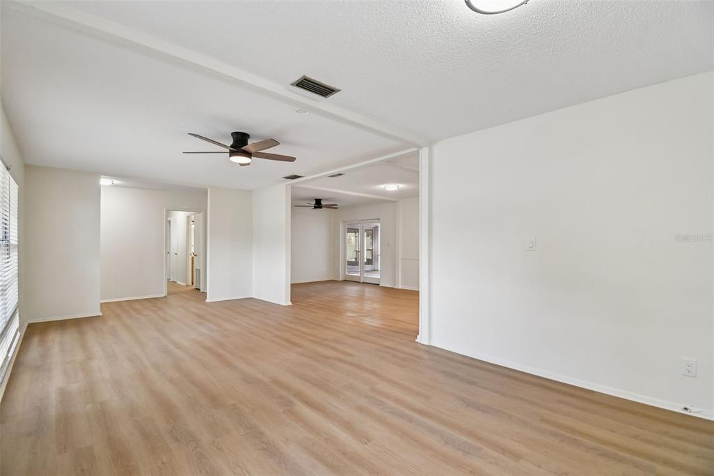 2708 Lion Heart Road Winter Park, FL 32792 - Photo 18 of 47 an empty room with wooden floor and windows