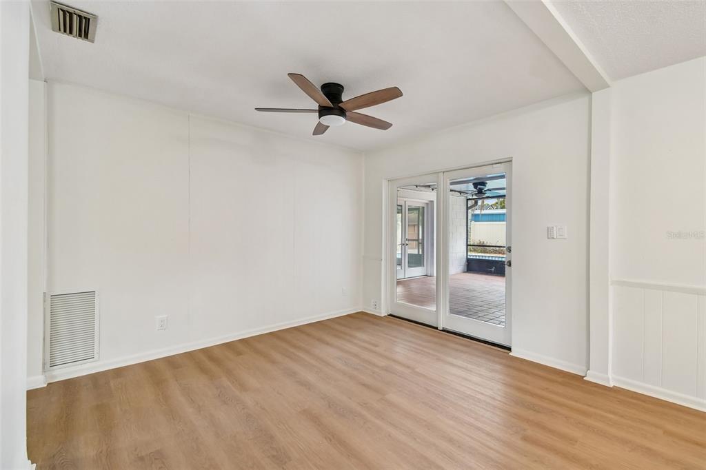 2708 Lion Heart Road Winter Park, FL 32792 - Photo 19 of 47 a view of empty room with wooden floor and ceiling fan