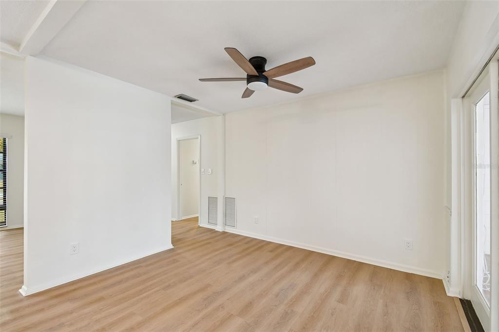 2708 Lion Heart Road Winter Park, FL 32792 - Photo 20 of 47 an empty room with wooden floor and windows