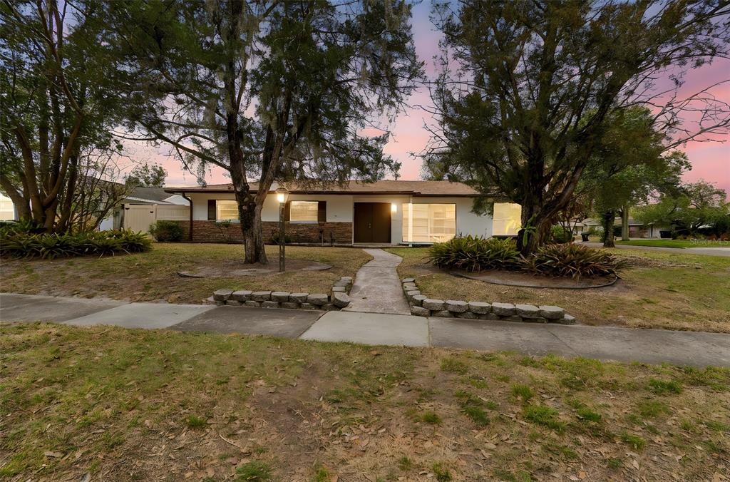 2708 Lion Heart Road Winter Park, FL 32792 - Photo 2 of 47 a view of a house with a yard