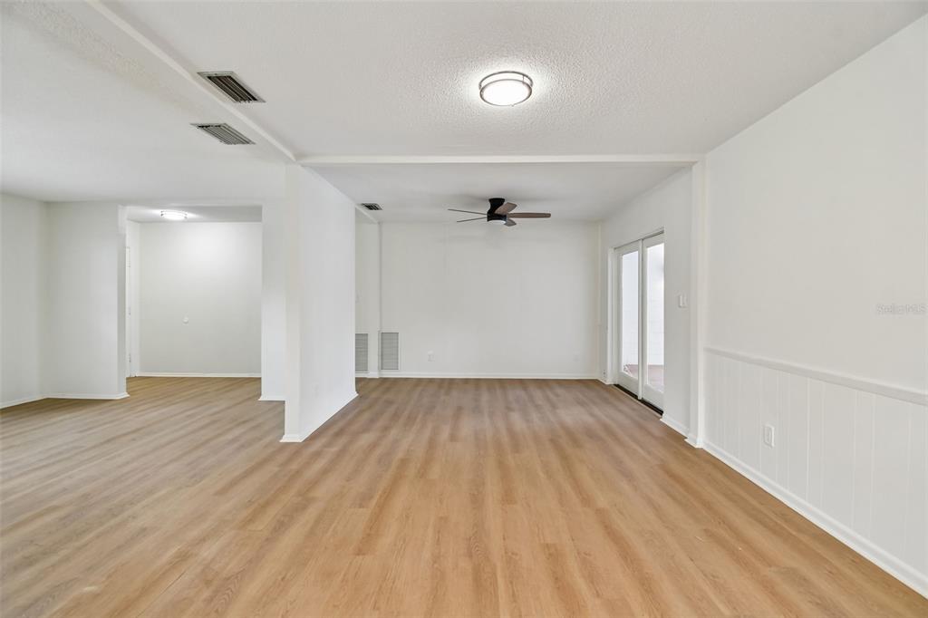 2708 Lion Heart Road Winter Park, FL 32792 - Photo 21 of 47 an empty room with wooden floor and windows