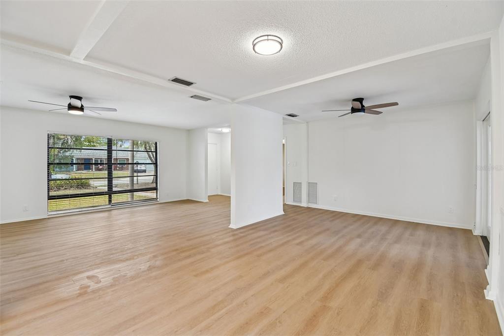 2708 Lion Heart Road Winter Park, FL 32792 - Photo 26 of 47 a view of an empty room with a window and wooden floor