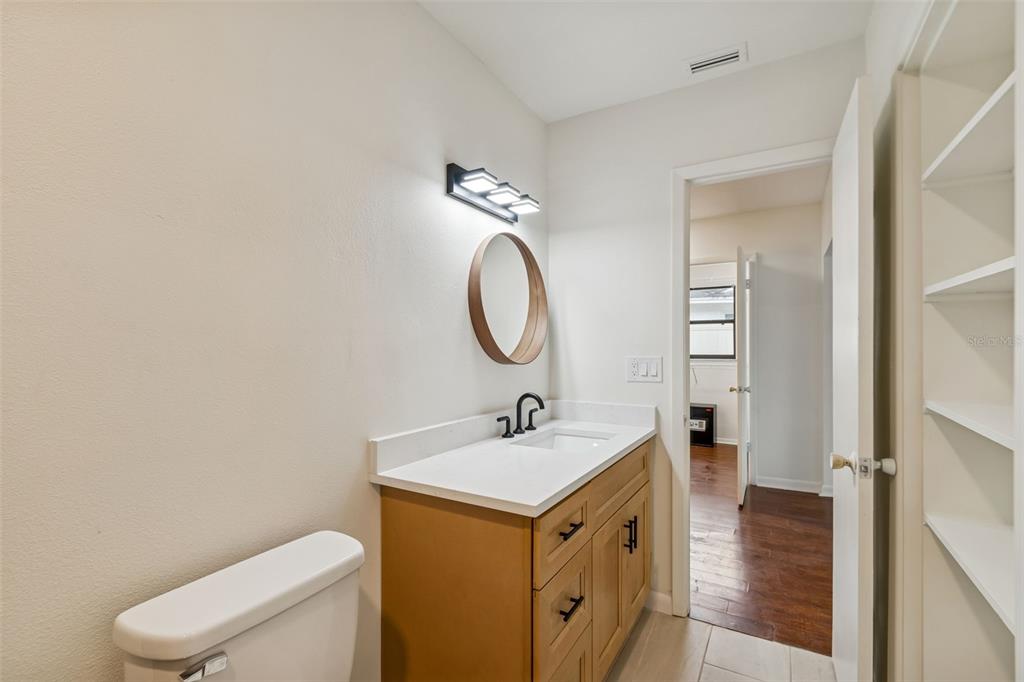 2708 Lion Heart Road Winter Park, FL 32792 - Photo 32 of 47 a bathroom with a sink toilet and a mirror