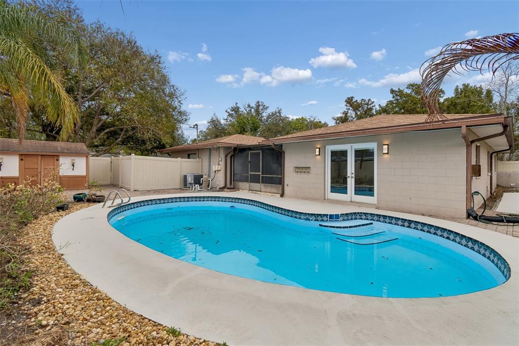 2708 Lion Heart Road Winter Park, FL 32792 - Photo 44 of 47 a view of a house with swimming pool and porch