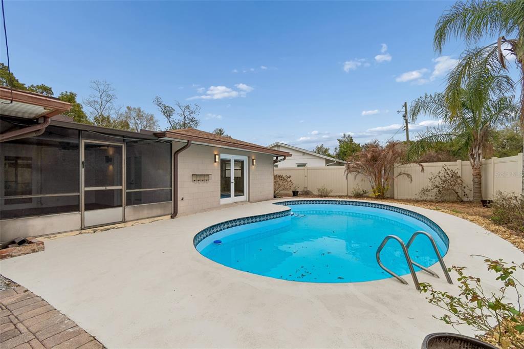 2708 Lion Heart Road Winter Park, FL 32792 - Photo 46 of 47 a swimming pool with outdoor seating and yard
