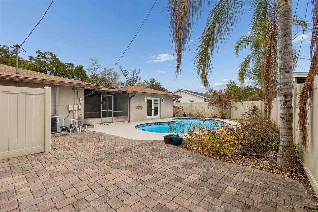 2708 Lion Heart Road Winter Park, FL 32792 - Photo 47 of 47 a front view of a house with a yard and potted plants