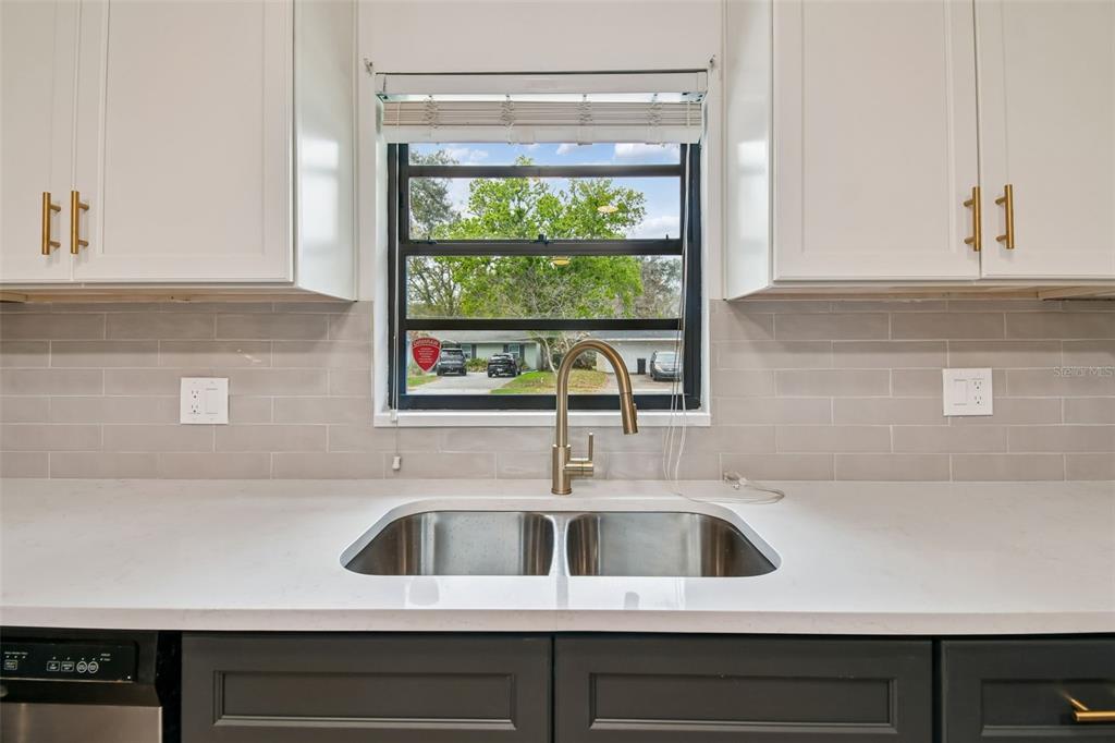 2708 Lion Heart Road Winter Park, FL 32792 - Photo 10 of 47 a kitchen with a sink and a window