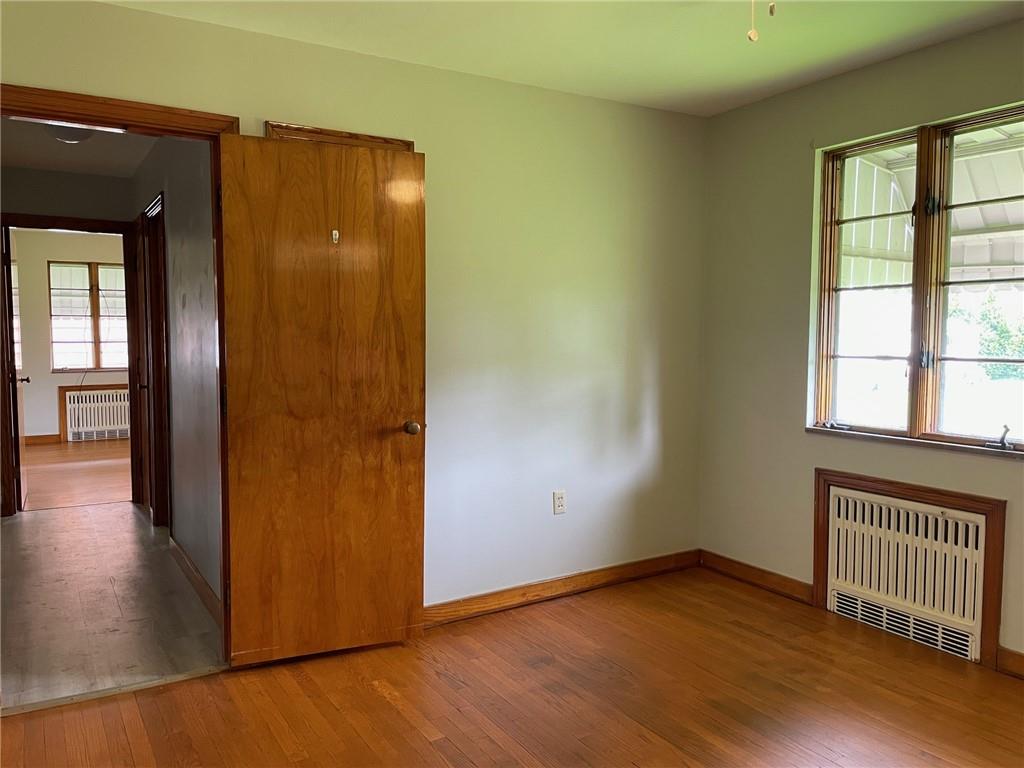 4517 Lincoln Avenue Jeannette, PA 15644 - Photo 20 of 37 an empty room with wooden floor and windows