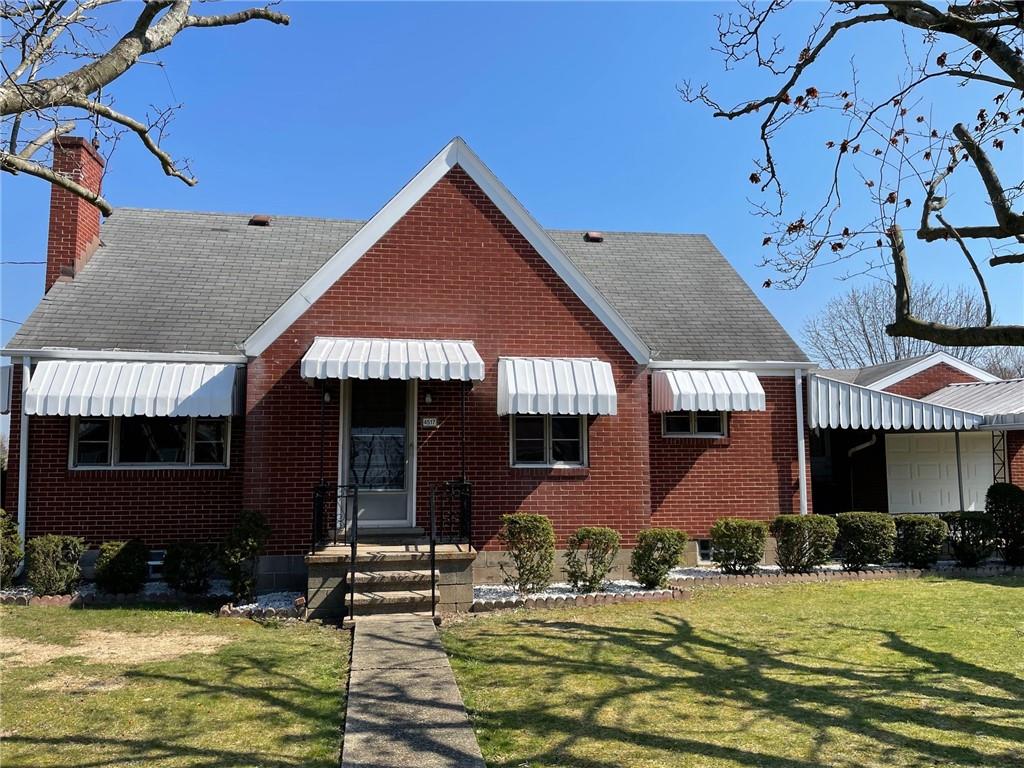 4517 Lincoln Avenue Jeannette, PA 15644 - Photo 2 of 37 front view of a house with a yard